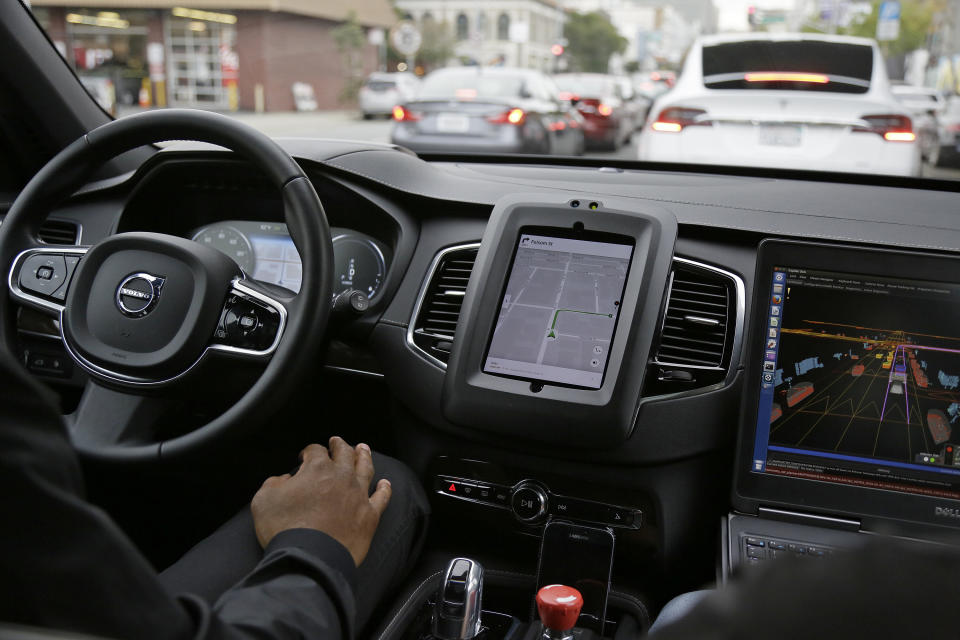 In this Dec. 13, 2016 photo, an Uber driverless car waits in traffic during a test drive in San Francisco. (AP Photo/Eric Risberg, File)