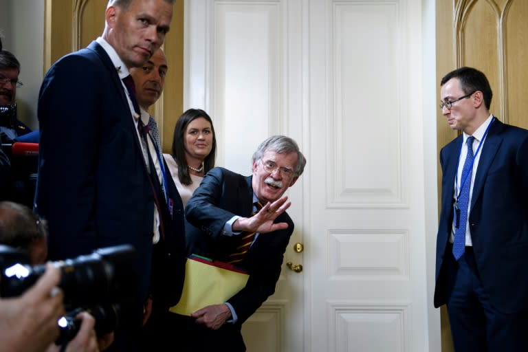 US National Security Advisor John Bolton waves to the press as he awaits President Donald Trump's meeting with Russian counterpart Vladimir Putin in July 2018 in Helsinki, where Trump controversially excluded his aides for two hours