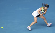 Ukraine's Elina Svitolina hits a backhand to Kazakhstan's Yulia Putintseva during their third round match at the Australian Open tennis championships in Melbourne, Australia, Saturday, Feb. 13, 2021. (AP Photo/Hamish Blair)