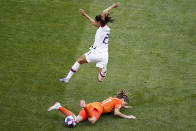 United States' Christen Press jumps over Netherlands' Danielle Van De Donk during the Women's World Cup final soccer match between US and The Netherlands at the Stade de Lyon in Decines, outside Lyon, France, Sunday, July 7, 2019. (AP Photo/Francois Mori)