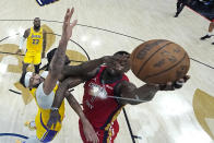 New Orleans Pelicans forward Zion Williamson (1) goes to the basket against Los Angeles Lakers forward Anthony Davis and forward Taurean Prince in the first half of an NBA basketball play-in tournament game Tuesday, April 16, 2024, in New Orleans. (AP Photo/Gerald Herbert)