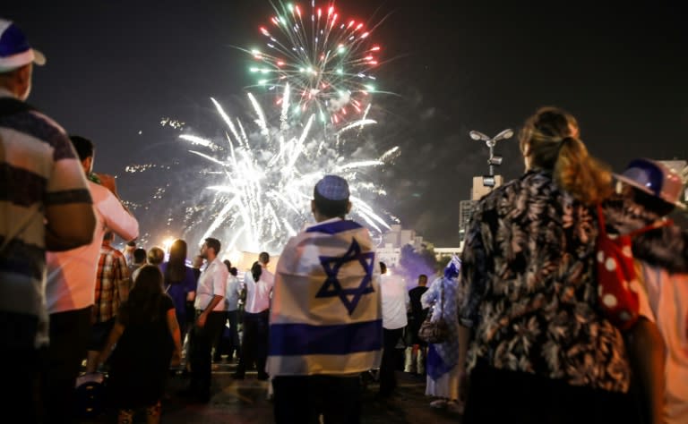 Israelis watch fireworks over Jerusalem on April 18, 2018, as they celebrate the 70th anniversary of the country's independence