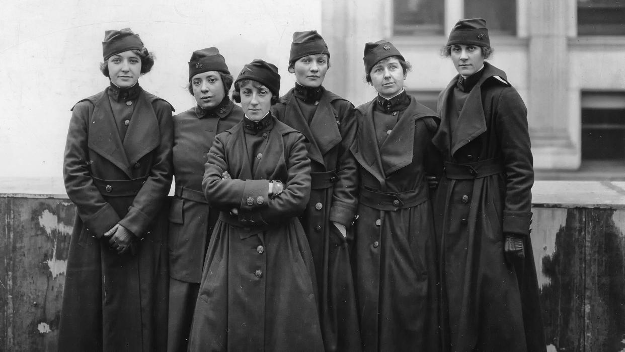 Six members of the U.S. Army Signal Corps preparing to ship off for France in 1918, where they and 217 other women served as switchboard operators. Grace Banker, chief operator for the Signal Corps, stands second from the right.