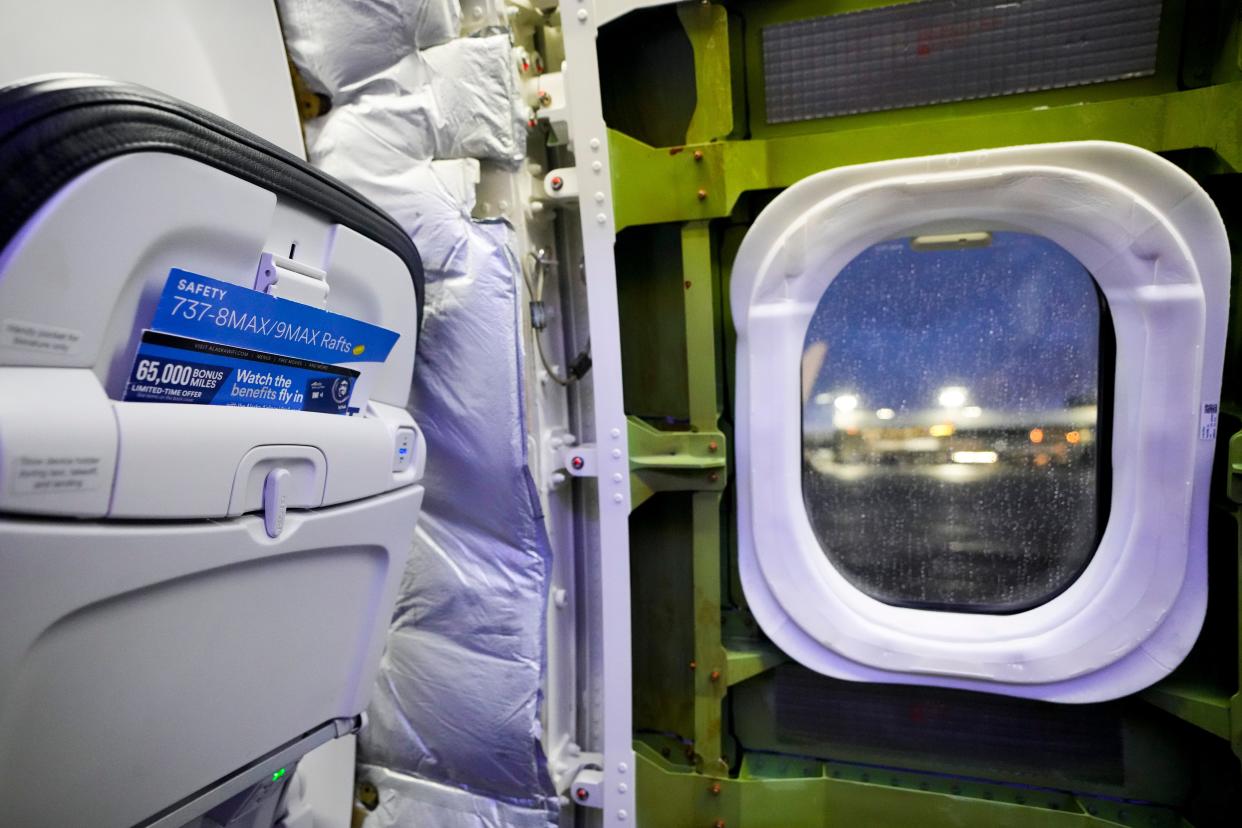 A door plug area of an Alaska Airlines Boeing 737 Max 9 aircraft awaits inspection with paneling removed at the airline's facilities at Seattle-Tacoma International Airport on Jan. 10, 2024.