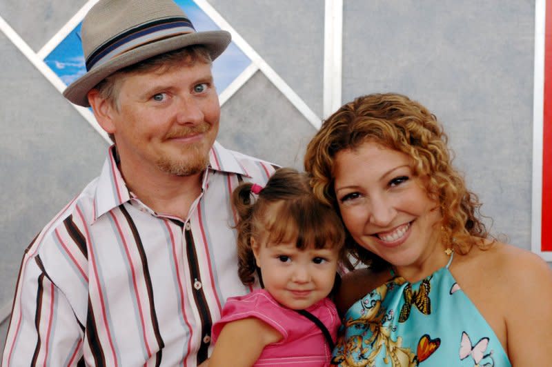Dave Foley (L), a cast member in the comedy "Sky High," arrives with his wife, Crissy, and their 2-year-old daughter, Alina, at the premiere of the film in Los Angeles in 2005. File Photo by Jim Ruymen/UPI
