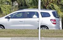 A vehicle carrying U.S. swimmers Jack Conger and Gunnar Bentz drives away from a hotel near Rio de Janeiro's international airport after they were stopped from boarding a flight to the United States and questioned by police, days after their participation in the Rio 2016 Olympic Games, August 18, 2016. REUTERS/Bruno Kelly