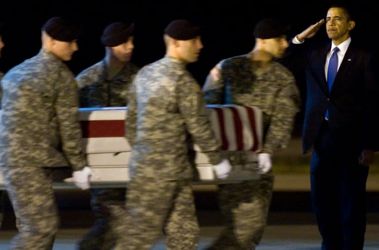 US President Barack Obama salutes during the October 29, 2009 return of the remains of Sergeant Dale R. Griffin, killed by a roadside bomb in Afghanistan