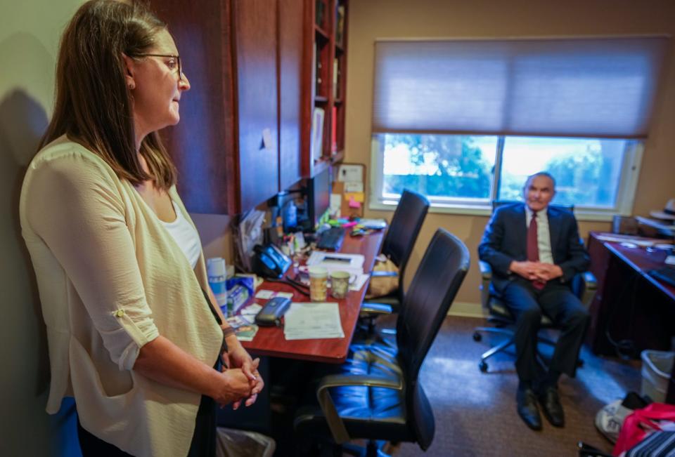 Julie Smith, former clinic manager speaks with Dr. L.L. “Tad” Davis at the Austin Women's Health Center. Davis founded the practice in 1976 to provide the full spectrum of reproductive health care, from birth control to menopausal care. But a sizable part of the practice was providing abortions — until Texas banned the procedure last year.