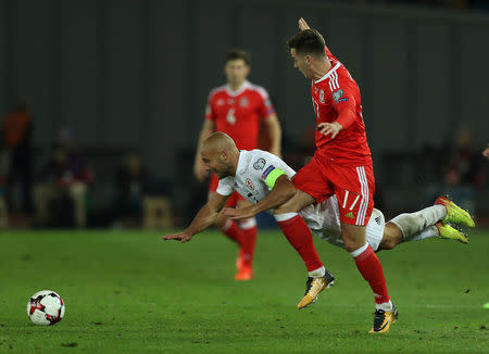 Soccer Football - 2018 World Cup Qualifications - Europe - Georgia vs Wales - Boris Paichadze Dinamo Arena, Tbilisi, Georgia - October 6, 2017 Georgia’s Jaba Kankava in action with Wales' Tom Lawrence Action Images via Reuters/Peter Cziborra