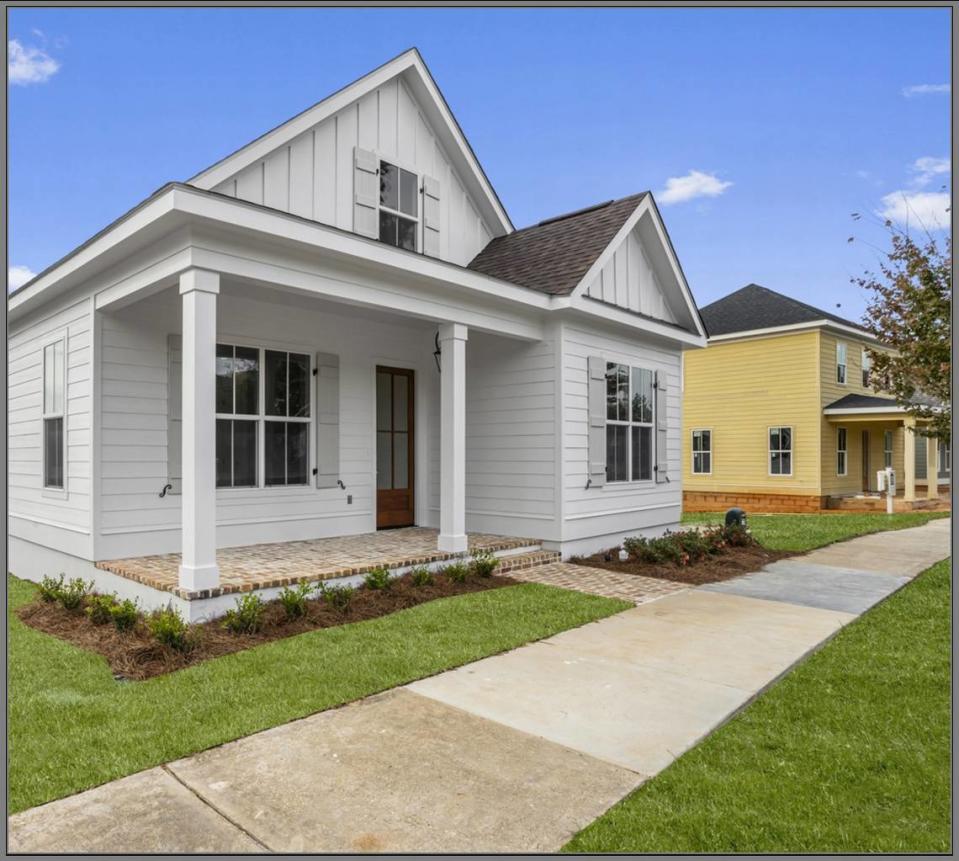 “Lakeside” has the look of a classic shotgun house with an open floor plan and modern and classic finishes. It was built by Tootle Homes at The Village at Tradition.
