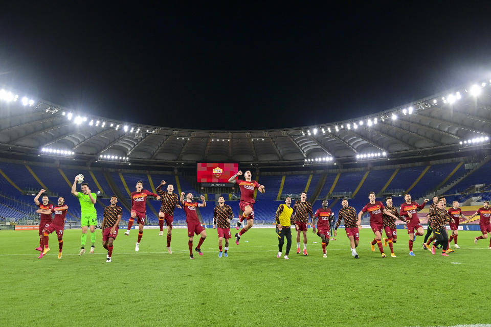 Roma players celebrate their victory at the end of an Italian Serie A soccer match between Roma and Lazio, at Rome's Olympic Stadium, Saturday, May 15, 2021. Roma won 2:0. (Fabio Rossi/LaPresse via AP)