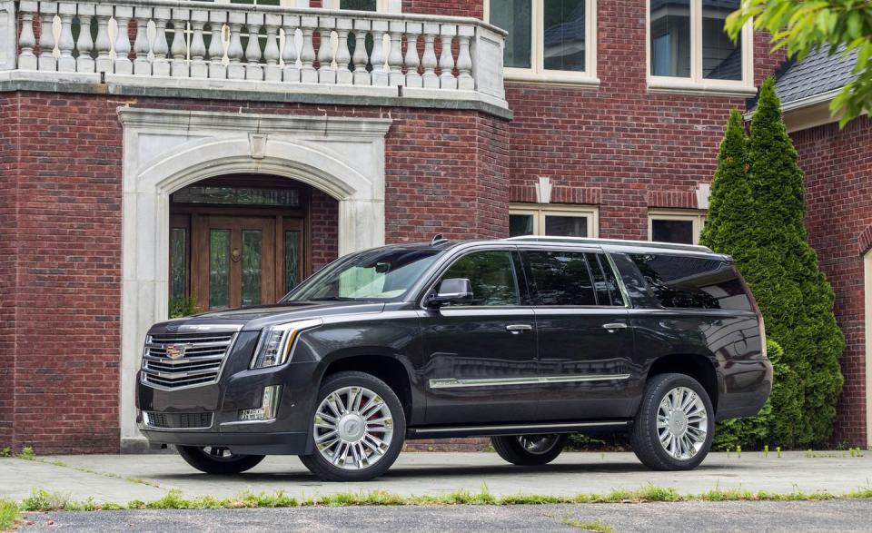 <p>Welcome to this list the first of three General Motors–produced full-size SUV duos, <a rel="nofollow noopener" href="https://www.caranddriver.com/cadillac/escalade-escalade-esv" target="_blank" data-ylk="slk:the Cadillac Escalade and Escalade ESV;elm:context_link;itc:0;sec:content-canvas" class="link ">the Cadillac Escalade and Escalade ESV</a>. The former is the short-wheelbase model, while the latter has a longer wheelbase and way more (25 cubic feet more!) cargo space behind its third-row seat. Beneath the Escalades' considerable bling are structural and mechanical bits shared with the GMC Yukon and Yukon XL, as well as the Chevrolet Tahoe and Suburban. A 420-hp V-8 and a 10-speed automatic transmission is standard; all-wheel drive is optional. Pricing is astronomical, even though the build quality is merely so-so and the truck drives like, well, a truck, with a rough ride and reluctant handling. Seeing as how you can buy essentially the same vehicles for less from other a GMC or Chevy dealership, the Cadillac's value play is woeful, placing it behind those siblings in our rankings.</p>