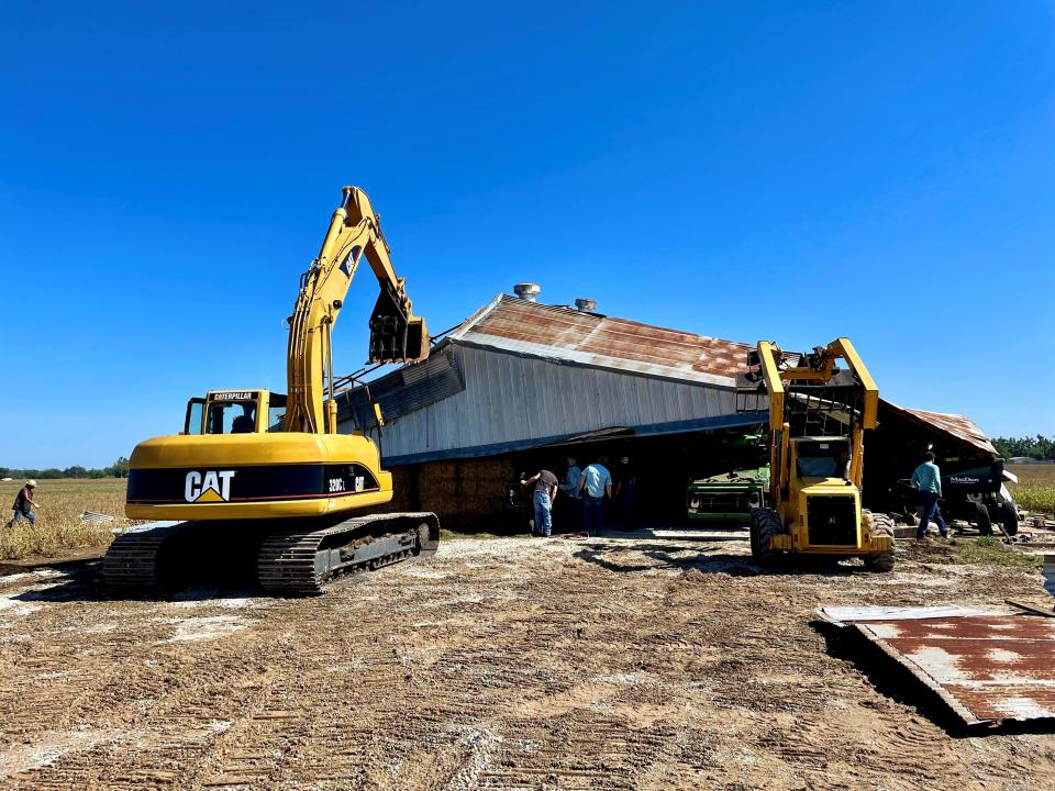 Neighbors including one that owns the trackhoe wasted no time in coming to help Robert Nowakowski and his family deal with a collapsed barn on their farm near Dale that was taken out by a storm on Sunday night.