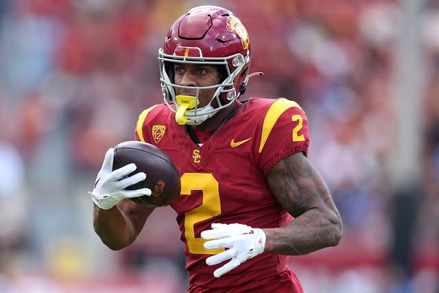 <p>Sean M. Haffey/Getty Images</p> Brenden Rice #2 of the USC Trojans runs the ball after a reception during the first half of a game against the UCLA Bruins