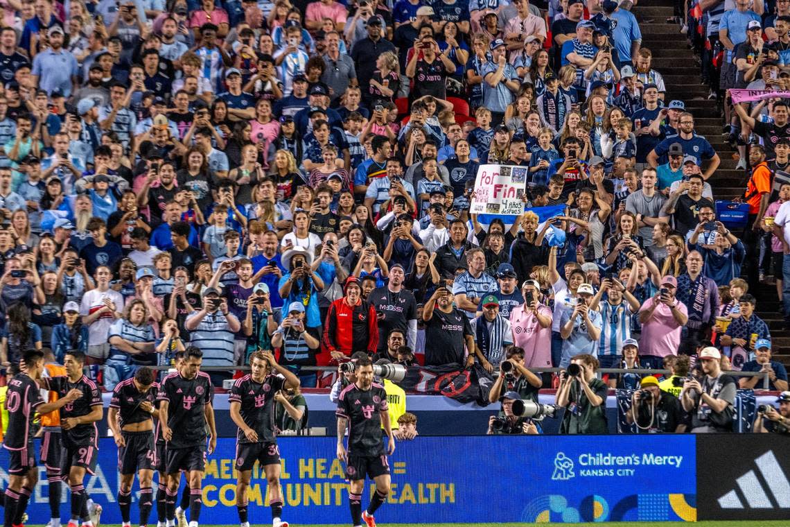 A ‘Por Fin’ sign, meaning ‘Finally’ in English, is visible in the distance during the match between Sporting Kansas City and Inter Miami at GEHA Field at Arrowhead Stadium, Saturday, April 13, 2024, in Kansas City. Emily Curiel/ecuriel@kcstar.com