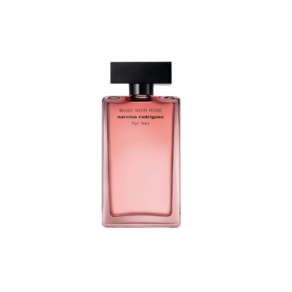 A pink glass bottle of perfume with a black lid.