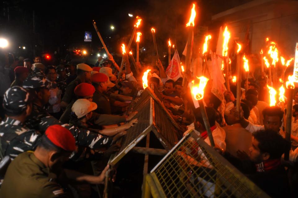 Indian security personnel try to stop activists of the All Assam Students Union (AASU) during a protest march after the central government implemented the Citizenship (Amendment) Act in Nagaon district, Assam, India, March 12, 2024. / Credit: Anuwar Hazarika/NurPhoto/Getty