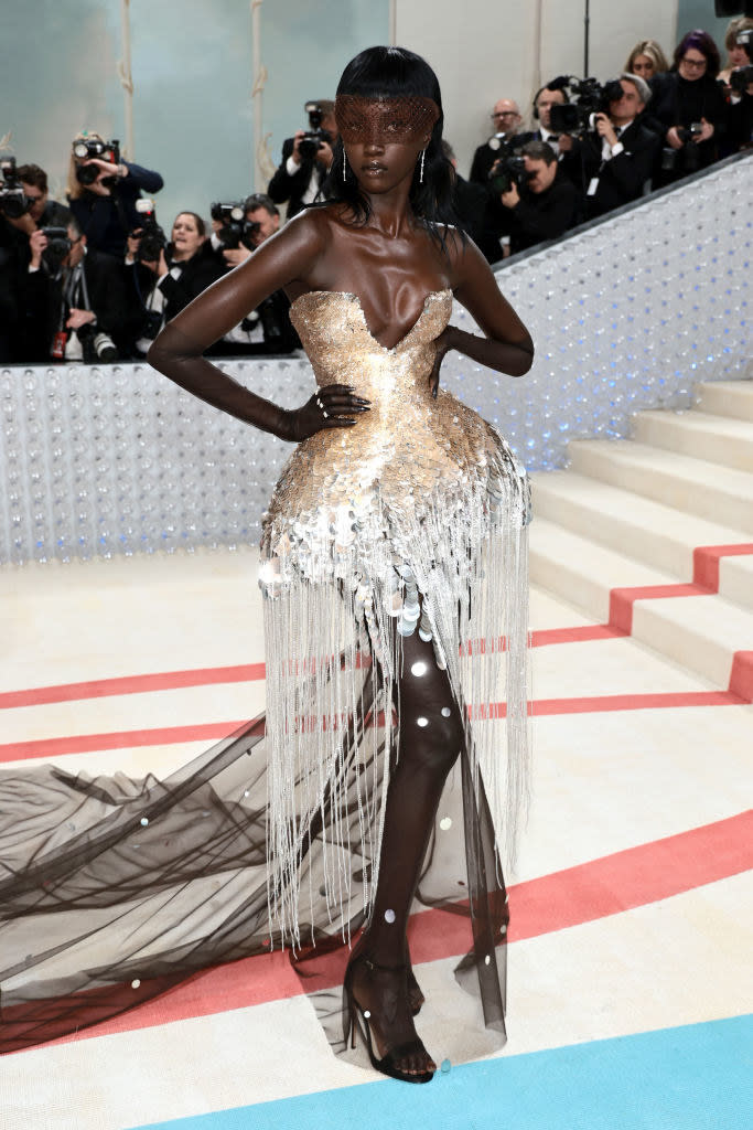 Anok Yai attends The 2023 Met Gala in a fringe gown