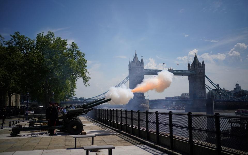 Members of the Honourable Artillery Company fire a 62-round gun salute from the wharf at the Tower of London, to mark the anniversary of the Coronation of Queen Elizabeth II on Wednesday - PA