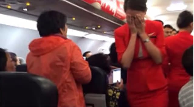 An Air Asia flight turned around after a passenger threw a cup of hot water on a flight attendant. Photo: YouTube