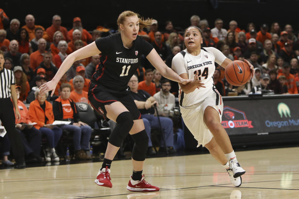 Stanford's Ashten Prechtel (11) keeps up with Oregon State's Destiny Slocum (24) as she sprints upcourt during the first half of an NCAA college basketball game in Corvallis, Ore., Sunday, Jan. 19, 2020. (AP Photo/Amanda Loman)