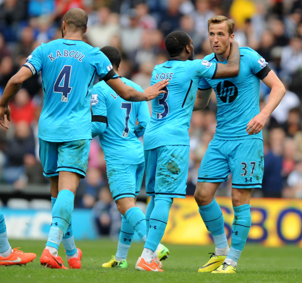 Tottenham Hotspur's Harry Kane, right, is congratulated by his teammates after scoring against West Bromich Albion during the English Premier League soccer match at The Hawthorns Stadium in West Bromwich, England, Saturday, April 12, 2014. (AP Photo/Rui Vieira)