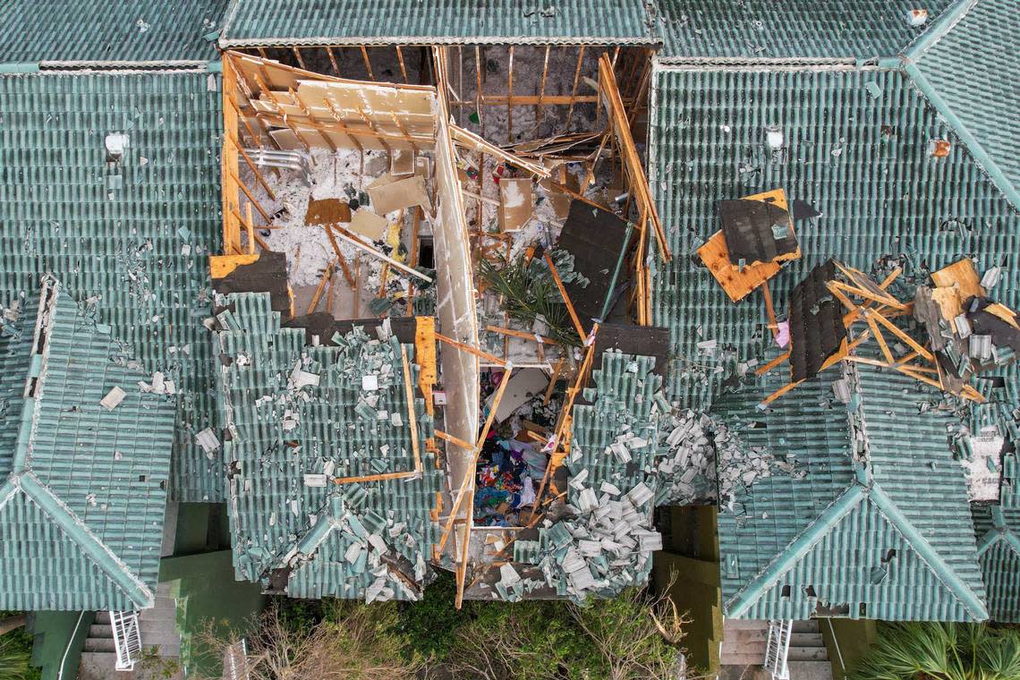 The roof of a building at the Sanctuary Cove Apartment complex is seen destroyed in the aftermath of a Saturday evening tornado on Sunday, April 30, 2023, in Palm Beach Gardens, Fla. The National Weather Service confirmed an EF-1 tornado touched down in Palm Beach Gardens Saturday evening.