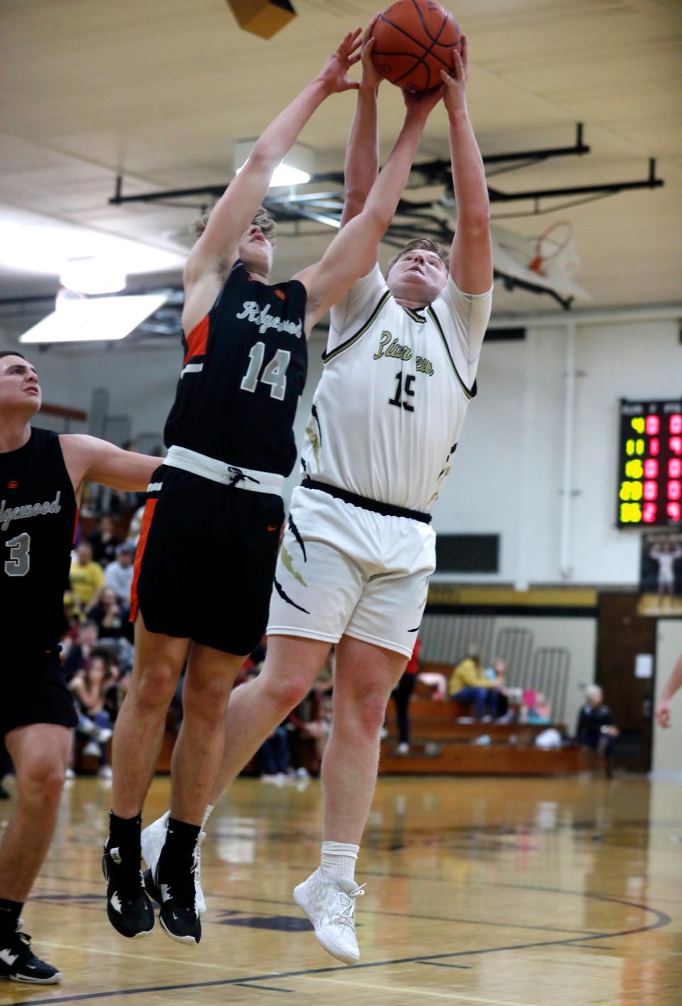 Ridgewood's Chris Matthews, left, and River View's Brody Shrimplin fight for a rebound during the Coshocton County Classic last year. Matthews highlights a young core for the Generals, who aim to improve on a 4-19 season.