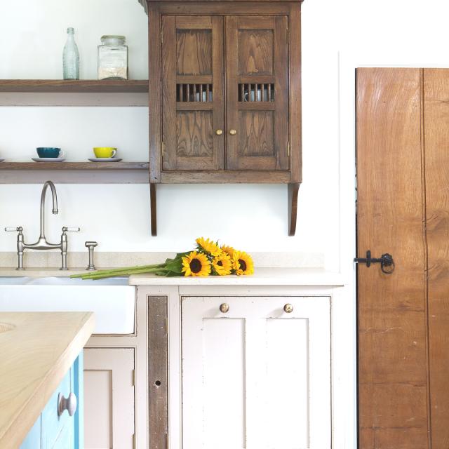 Beige Cabinets + Brass Hardware Bringing Charm To A Traditional Kitchen