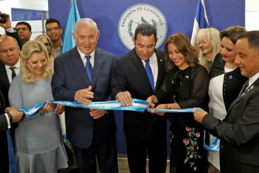 Sara Netanyahu and her husband Israeli Prime Minister Benjamin applaud as Guatemalan President Jimmy Morales and his wife Hilda Patricia Marroquin cut the ribbon during the inauguration ceremony of the Guatemalan embassy in Jerusalem on May 16, 2018