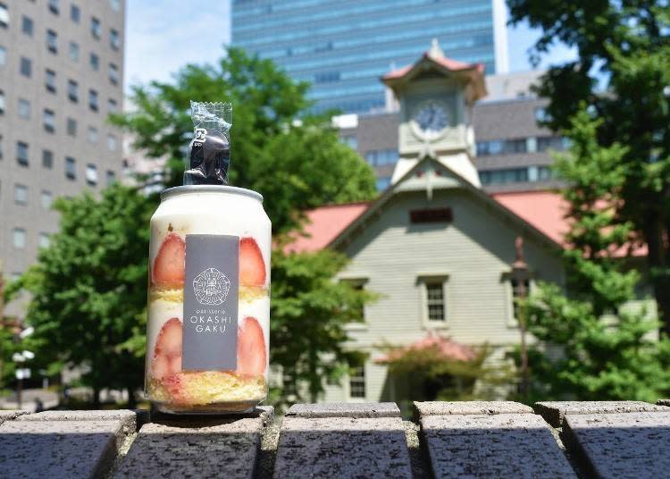 The Shortcake Can backed by the Sapporo Clock Tower.
