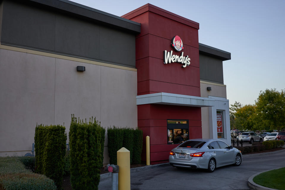 Portland, Oregon, USA - Sep 21, 2019: The drive-through window at a Wendy's Restaurant in Northeast Portland in the evening.