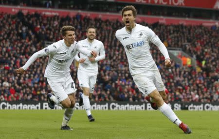 Britain Soccer Football - Liverpool v Swansea City - Premier League - Anfield - 21/1/17 Swansea City's Fernando Llorente celebrates scoring their second goal with Tom Carroll Action Images via Reuters / Ed Sykes Livepic EDITORIAL USE ONLY.