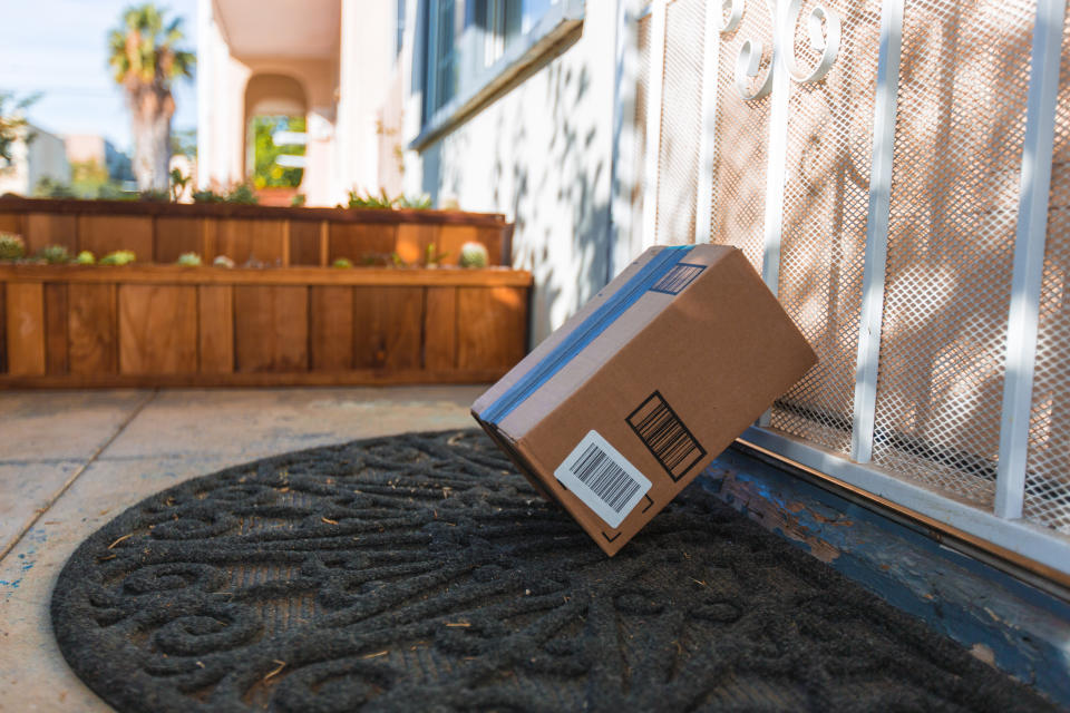 Los Angeles CA, November 11/22/2017: Image of an Amazon packages. Amazon is an online company and is the largest retailer in the world. Cardboard package delivery at front door during the holiday season. shipping package parcel box on wooden floor with protection paper inside. Amazon.com went online in 1995 and is now the largest online retailer in the world.