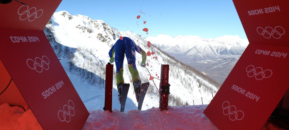 Slovenia's Klemen Kosi kicks off from the start hut in a men's downhill training run for the 2014 Winter Olympics, Thursday, Feb. 6, 2014, in Krasnaya Polyana, Russia. (AP Photo/Alessandro Trovati)