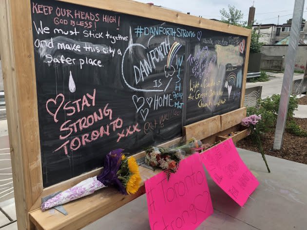 People have left messages on a chalkboard in a parkette in Toronto’s Greektown.