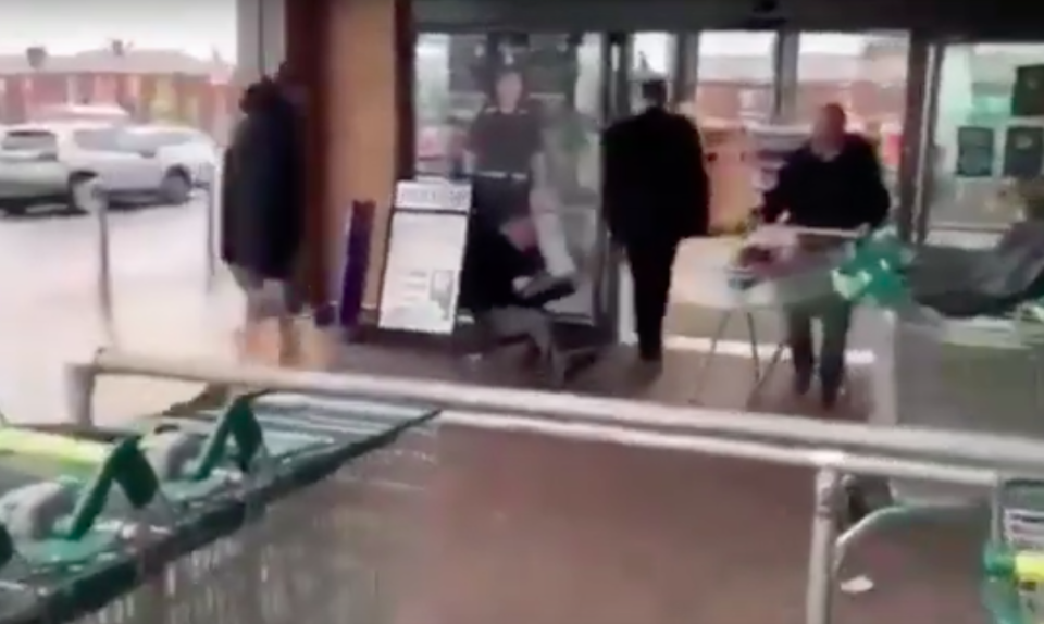 The campaigner was filmed being forced to the floor by security (YouTube)