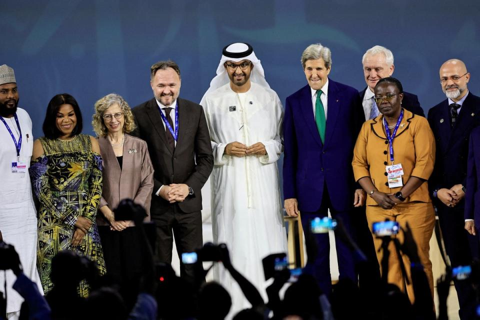 Cop28 president Sultan Ahmed al-Jaber and US climate envoy John Kerry join other officials at the Global Cooling Pledge on Tuesday (Reuters)