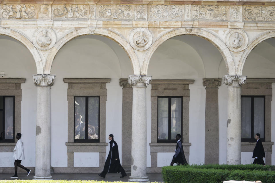 Models wear creations as part of the Valentino men's Spring Summer 2024 collection presented in Milan, Italy, Friday, June 16, 2023. (AP Photo/Luca Bruno)