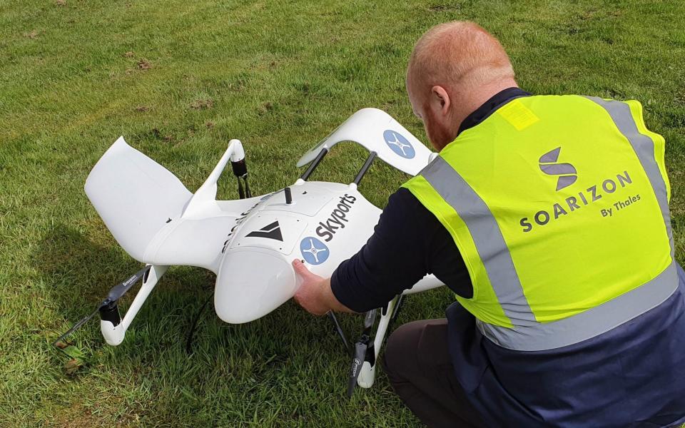 A technician from London-based drone delivery firm Skyports with a company drone, to be used for deliveries to Scotland's Isle of Mull - Skyports/PA