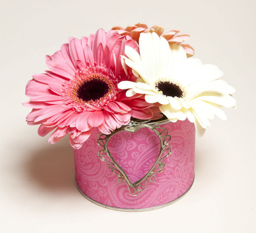 This is what our arrangement looked like when we used a peanut can, decorative craft paper and gerbera daisies. 