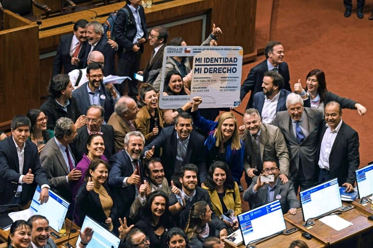 Chilean deputies for the Frente Amplio party, celebrating in September with a giant fake Chilean Identity card reading "My identity, my right", after voting a gender identity law that allows the change of name and sex in public records from the age of 14: it was signed into law Wednesday by President Sebastian Pinera