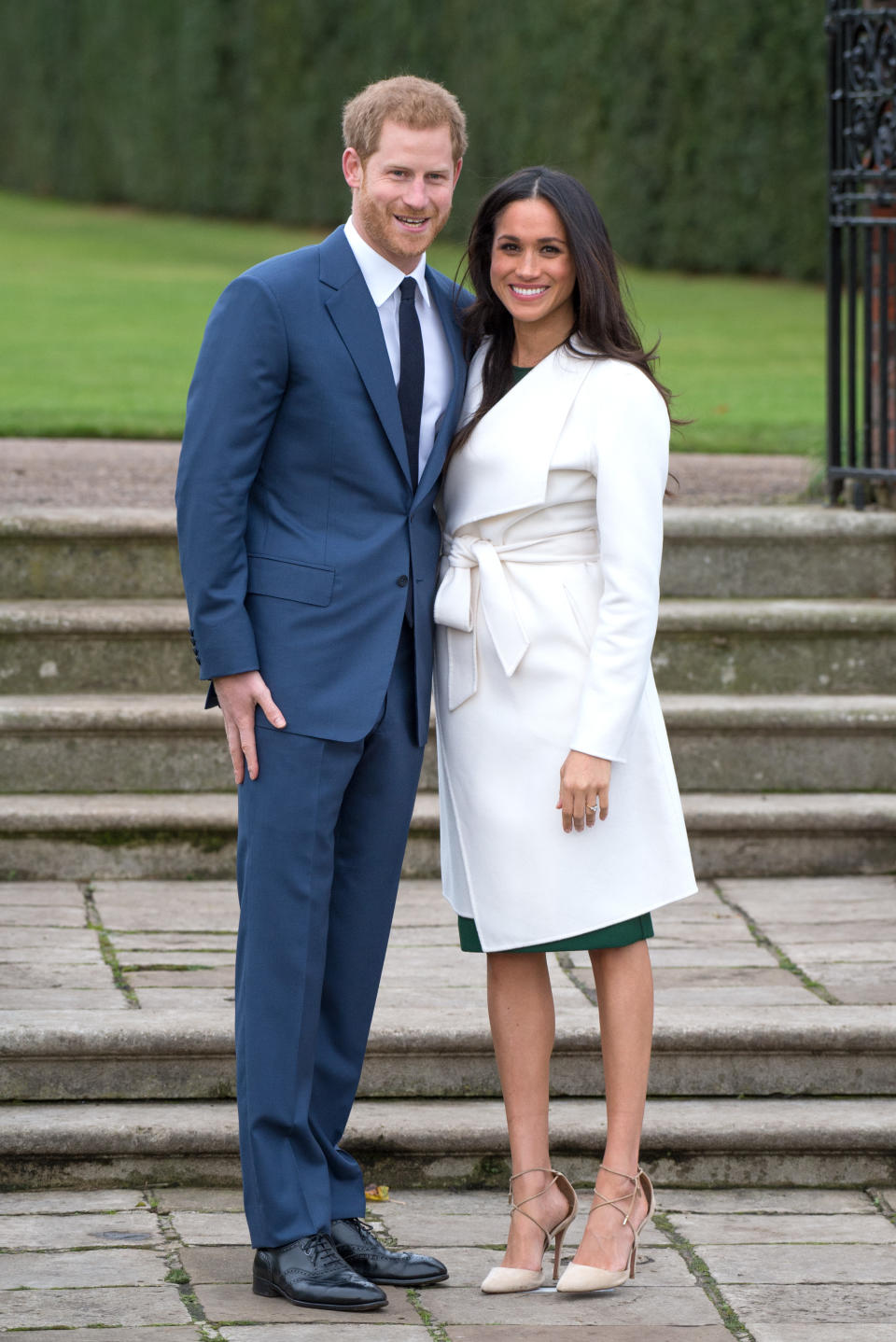 Just over one year later in November 2018, Markle wore a white belted coat by Canadian brand Line The Label during her and Prince Harry's photo-call announcing their engagement to the public. (Photo: Getty Images)