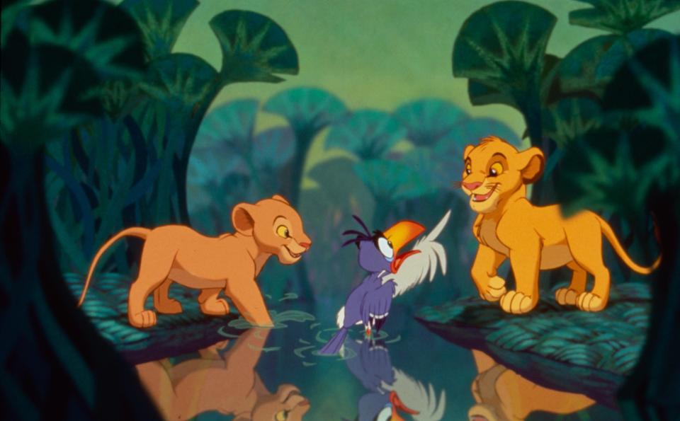 Animated characters Simba, Nala, and Zazu from "The Lion King" in a jungle scene