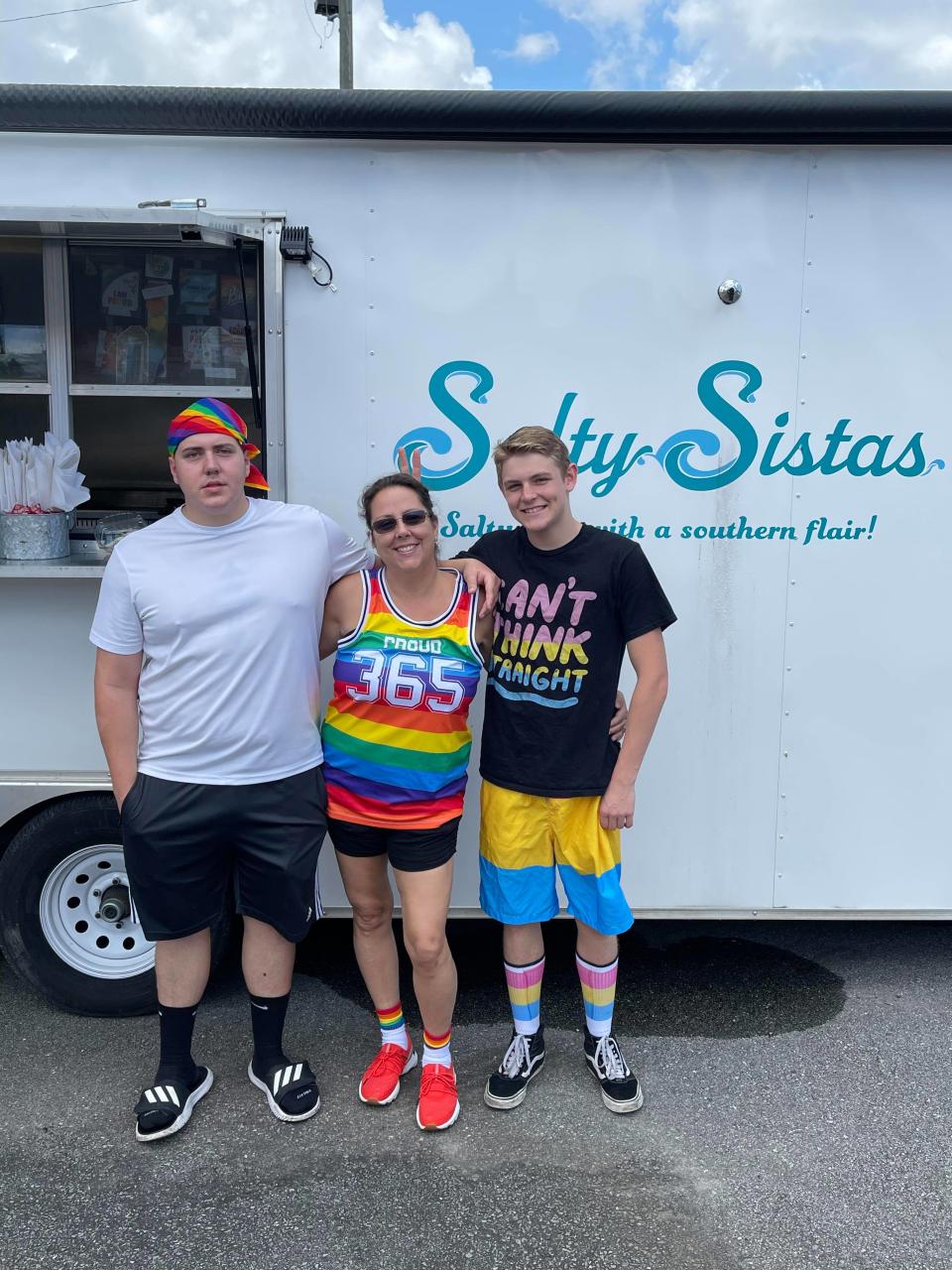 Salty Sistas owner Jeanette Georgitis (middle) with her sons during Jacksonville's 2021 Pride Festival, hosted by Jacksonville beauty salon, Kimage.