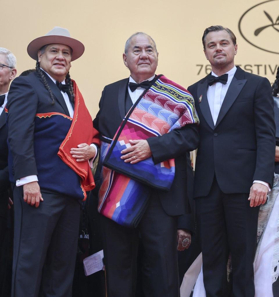 From left, Osage actor Yancey Red Corn, Osage Nation Chief Geoffrey Standing Bear and Leonardo DiCaprio arrive at the May 20 Cannes Film Festival premiere of "Killers of the Flower Moon" in France.