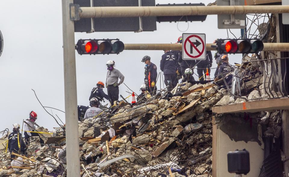 Search and rescue teams look for survivors at the 12-story oceanfront condo, Champlain Towers South, on Wednesday, June 30, 2021, in Surfside, Fla., seven days after the building collapsed. (Pedro Portal/Miami Herald via AP)
