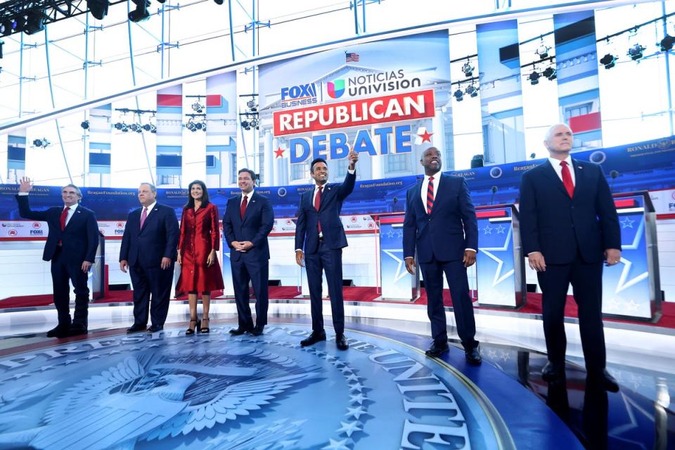 Republican presidential candidates on stage – minus Trump (Getty Images)