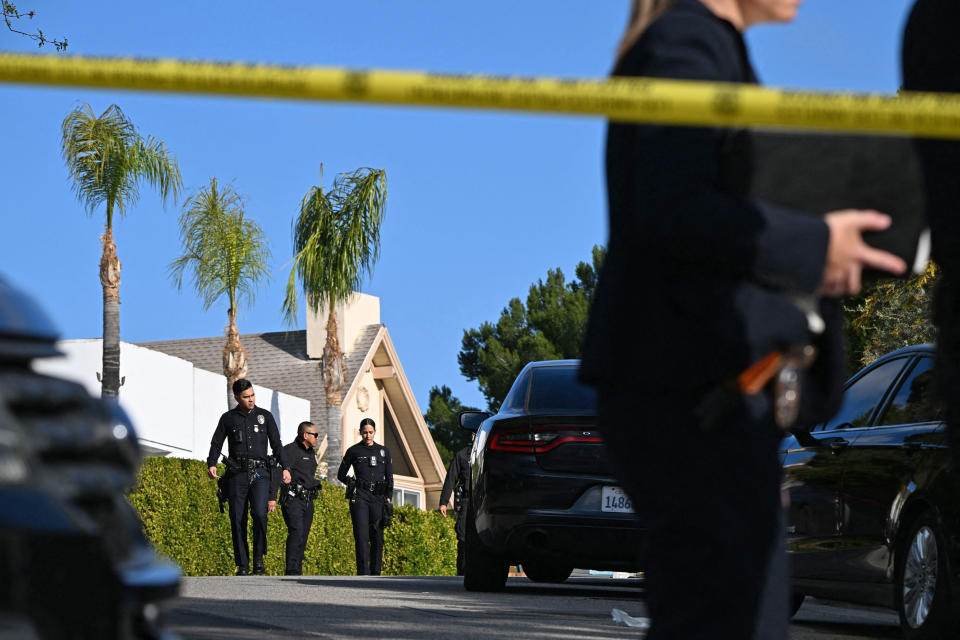 Law enforcement work an investigation of an early morning shooting in Beverly Crest, Los Angeles. (Robyn Beck / AFP via Getty Images)