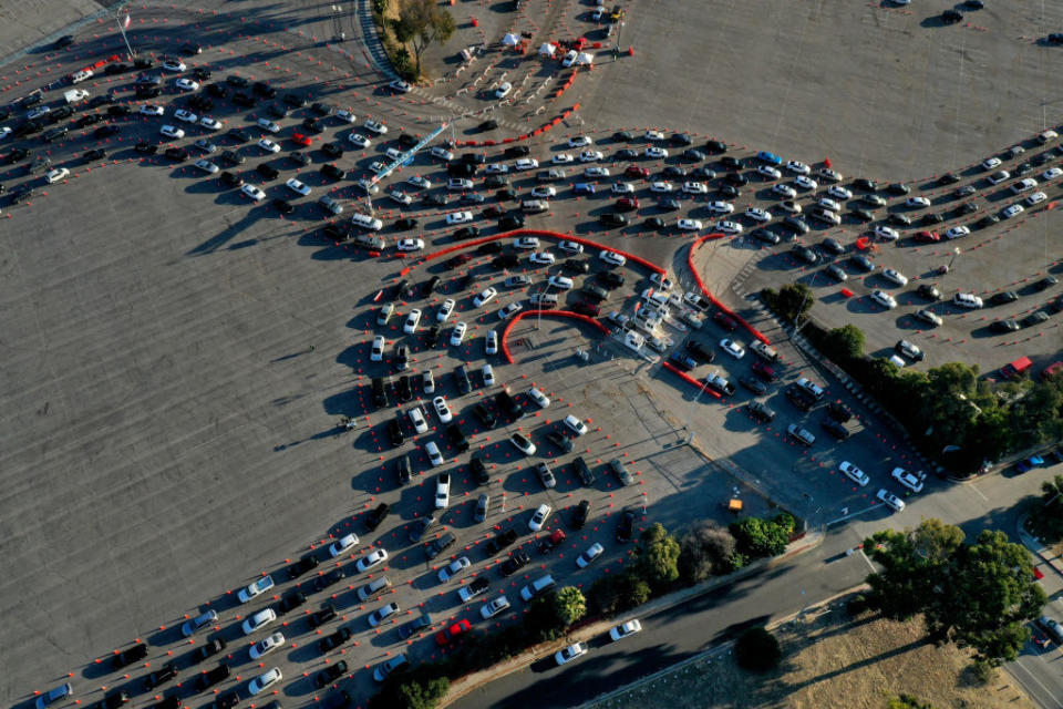 A long queue of cars at a busy coronavirus testing station at Dodger stadium. 